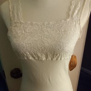 Used,not new white stretch camisole with lace front covering under breasts.